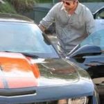 Brad pitt with Chevy Camaro SS image.