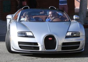Arnold Schwarzenegger with Bugatti Veyron Vitesse image.