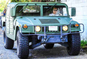 Arnold Schwarzenegger with Hummer H1 image.