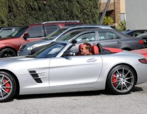 Arnold Schwarzenegger with Mercedes-Benz SLS AMG Roadster image.