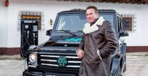 Arnold Schwarzenegger with Mercedes electric G-Wagen image.