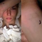 J tattoo on her wrist