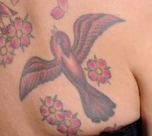 Lena Headey bird tattoo