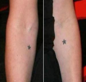 Lena headley black star tattoos on both elbows