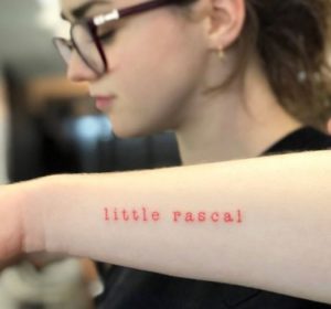 Maisie Williams tattooed word little rascal on her forearms