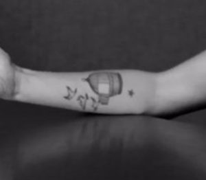 Open cage tattoo Lena Headey