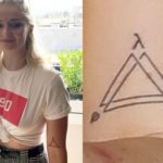 Sophie Turner upper arm tattoo triange