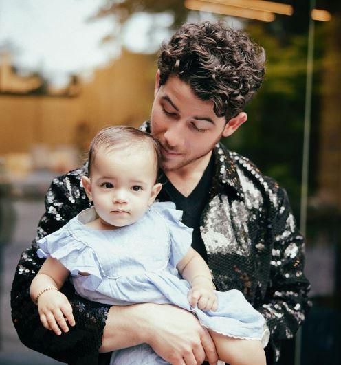 Nick Jonas with his daughter Malti Marie Chopra Jonas