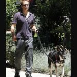 Sam Rockwell walking with his dog