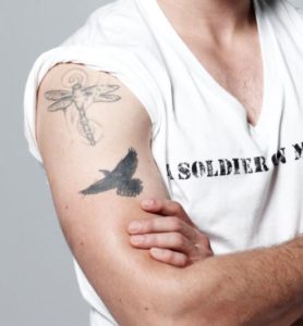 Steven R McQueen Right hand biceps tattoos