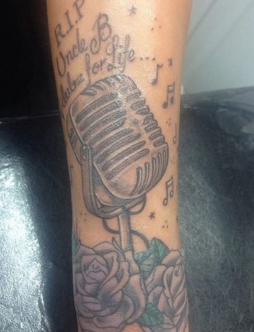 Tulisa Contostavlos tattooed vintage mic on her left wrist