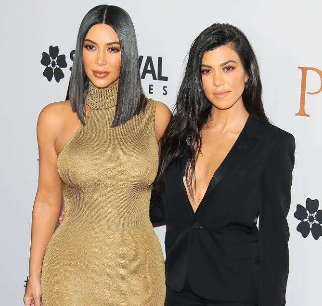 Kourtney Kardashian with sister Kim Kardashian