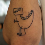 Finn s dinasor tattoo in his elbow image.