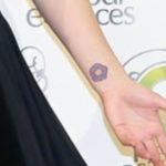 Leighton Meester flower tattoo on wrist
