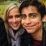 Aidan Gallagher with his mother image