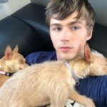 Miles Heizer with his pet dogs