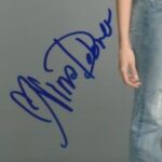 Nina Dobrev signature