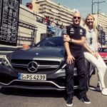 Bottas and his wife with his Mercedes black sclass image