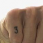 Daniel's finger nomber 3 tattoo image.