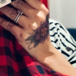 Morena hand tattoo image. | Celebrities InfoSeeMedia