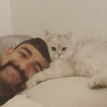 Sodhi and his pet cat image.