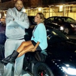 Carmelo Anthony and his wife with his Ferrari car