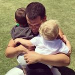 Derek Carr and his two son