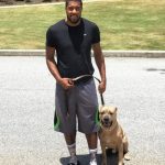 Derrick Favors with his pet dog