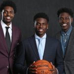 Jrue Holiday with his two brothers
