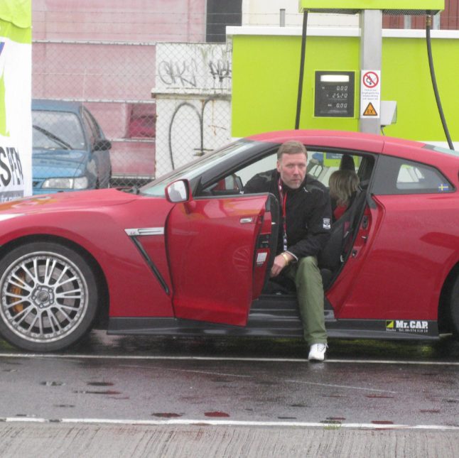 Mikael Persbrandt with his car
