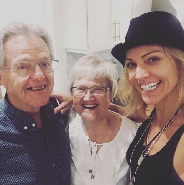 Tricia Helfer with her father and mother