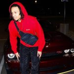 Amir Coffey with his mustang car