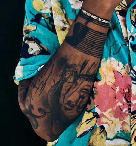 Lena Waithe's right hand tattoos | Celebrities InfoSeeMedia