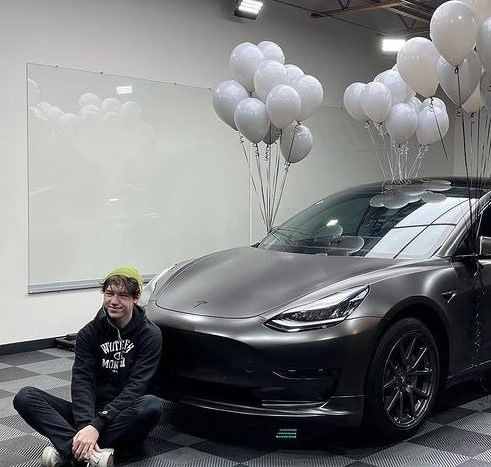 Devin Druid with his Tesla car
