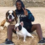 William Carvalho with his pet dogs