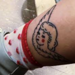 Melanie Martinez tattoo left leg