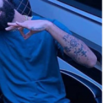 Arcángel's left hand tattoos