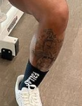 HaHa Davis Tattoo on left leg