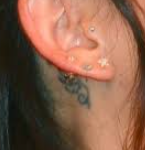 Janel Parrish Tattoo behind ear