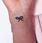 Janel Parrish Tattoo on right hand wrist