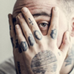 Mac Miller Tattoo on left hand wrist