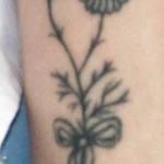 Marzia Kjellberg flower tattoo on left hand