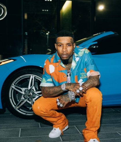 Tory Lanez with his car