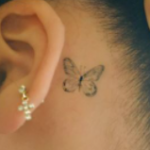 Vanessa Morgan tattoo on ear