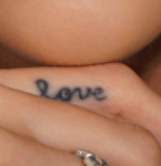Carli Bybel Tattoo on right hand finger