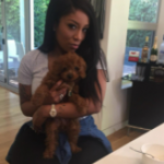 K. Michelle with her pet dog