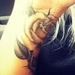 Lou Teasdale Tattoo on right hand