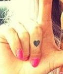 Lou Teasdale Tattoo on right hand finger