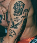 Macklemore Tattoo on left hand-