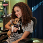 Madison Pettis with her pet dog